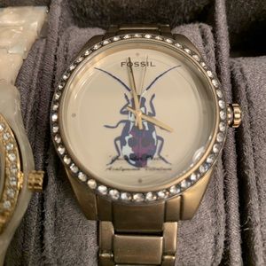 Gold fossil watch with beetle design